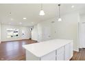 Modern kitchen with white cabinets, stainless steel appliances, and an island at 19432 Northwest Dr, Westfield, IN 46074