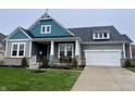 Two-story home with gray and teal siding, landscaping, and a welcoming front porch at 2378 Mossy Crk, Avon, IN 46123