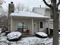 Condo exterior with snow-covered landscaping at 3250 Valley Farms Way, Indianapolis, IN 46214