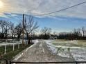 Long driveway leads to a farm with horses at 2750 N County Road 1000 E, Indianapolis, IN 46234