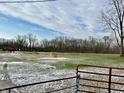 Snow-dusted pasture with horses and hay bales at 2750 N County Road 1000 E, Indianapolis, IN 46234