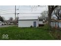 White detached garage in a grassy area at 4102 Spann Ave, Indianapolis, IN 46203