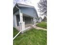 Gray house with a front porch and small yard at 4102 Spann Ave, Indianapolis, IN 46203