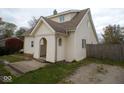 House exterior showcasing a charming front entrance and side view at 504 E Park St, Trafalgar, IN 46181