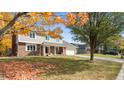 Two-story home with autumn foliage, showcasing curb appeal and a large front yard at 518 Deerberry Dr, Noblesville, IN 46062