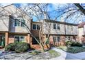 Brick front townhouse with green door, walkway, and landscaping at 9464 Maple Way # 27, Indianapolis, IN 46268