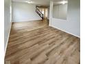 Spacious living room featuring light wood-look floors at 832 Spinney Ln, Whiteland, IN 46184