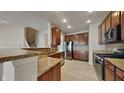 Modern kitchen with stainless steel appliances and granite countertops at 9558 Oakley Dr, Indianapolis, IN 46260