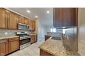 Kitchen features granite countertops and modern cabinetry at 9558 Oakley Dr, Indianapolis, IN 46260