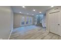 Bright living room with tile floors and access to a patio at 9558 Oakley Dr, Indianapolis, IN 46260