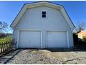 Detached two-car garage with gable roof and white doors at 8418 S State Road 39, Clayton, IN 46118