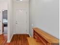 Bright and airy entryway with hardwood floors and a built-in desk at 10655 Swan Ct, Indianapolis, IN 46231
