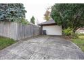 Detached single-car garage with a driveway at 1330 N Bosart Ave, Indianapolis, IN 46201
