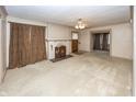 Spacious living room with hardwood floors and fireplace at 1330 N Bosart Ave, Indianapolis, IN 46201