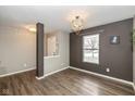 Bright dining area with hardwood floors and a chandelier at 2829 Wolfgang Way, Indianapolis, IN 46239