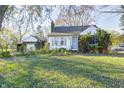 Brick ranch house with attached garage and spacious yard at 80 S Mickley Ave, Indianapolis, IN 46241