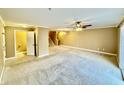 Spacious living room with neutral carpeting and a half bath at 1502 Autumn Oak St, Greenwood, IN 46143
