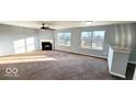 Bright living room featuring a fireplace and ample natural light at 3801 Boundary Bay Dr, Indianapolis, IN 46217