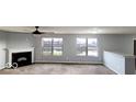 Spacious living room with fireplace and large windows at 3801 Boundary Bay Dr, Indianapolis, IN 46217