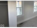 Spacious bedroom with neutral walls and new carpeting at 4745 W Legrande Ave, Indianapolis, IN 46241