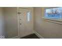 Bright entryway with white door and wood-look flooring at 4745 W Legrande Ave, Indianapolis, IN 46241