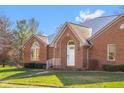 Brick facade with arched entryway and landscaping at 5059 Countess Dr, Columbus, IN 47203
