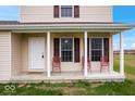 Front porch with two red metal chairs at 6005 S Darlington Rd, Jamestown, IN 46147
