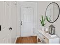 Bright entryway with console table and mirror at 10135 Bootham Close, Fishers, IN 46038