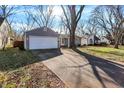 House with a long driveway and mature trees at 2121 E 70Th St, Indianapolis, IN 46220