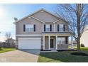 Two-story house with a neutral color scheme and stone accents at 3796 Indigo Blue Blvd, Whitestown, IN 46075