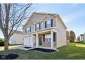 Two-story house with a neutral color scheme and stone accents at 3796 Indigo Blue Blvd, Whitestown, IN 46075