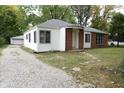 Brick ranch home with a gravel driveway and landscaping at 4143 N Kitley Ave, Indianapolis, IN 46226