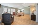 Spacious living room featuring vaulted ceilings, hardwood floors, and ample natural light at 5141 Montpelier Ct, Columbus, IN 47203