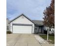 Ranch home with attached garage and landscaped yard at 5404 Burcham Way, Indianapolis, IN 46224