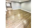 Spacious living room showcasing gleaming hardwood floors and gray walls at 7326 E 34Th St, Indianapolis, IN 46226