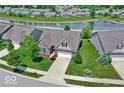 Property sits on a corner lot overlooking a pond at 14144 Stoney Shore Ave, McCordsville, IN 46055