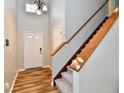 Bright entryway with hardwood floors, staircase, and neutral walls at 15230 Fawn Meadow Dr, Noblesville, IN 46060