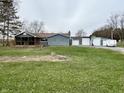 Ranch home with detached garage and expansive lawn at 890 N State Road 75, Lebanon, IN 46052