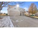 A two-story home with an attached garage and driveway at 17849 Grassy Knoll Dr, Westfield, IN 46074