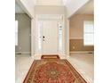 Bright entryway with tile flooring and a large oriental rug at 18272 Kinder Oak Dr, Noblesville, IN 46062