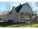 Side view of a charming gray house with a gabled roof at 3235 Adams St, Indianapolis, IN 46218