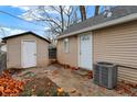 Back exterior of house with shed and patio at 355 Mcclure Rd, Columbus, IN 47201