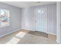 Bright living room with new flooring and neutral walls at 355 Mcclure Rd, Columbus, IN 47201