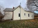 Rear view of house showing yard and additional structure at 430 S Proud St, Muncie, IN 47305