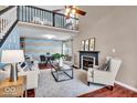 Spacious living room with fireplace and lofted area at 738 Charter Woods Dr, Indianapolis, IN 46224