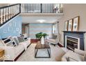 Bright living room featuring a fireplace and lofted ceiling at 738 Charter Woods Dr, Indianapolis, IN 46224