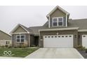 Attractive 2-story home with a large garage and well-manicured lawn at 8831 Twain Ln, Indianapolis, IN 46239