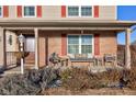 Inviting front porch with seating area, brick columns and landscaping at 2612 Kirk Ct, Lebanon, IN 46052