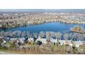 Aerial community view showing houses and lakefront property at 3424 Bay Rd S Dr, Indianapolis, IN 46240