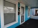Front door with security screen and porch light at 443 N Centennial St, Indianapolis, IN 46222
